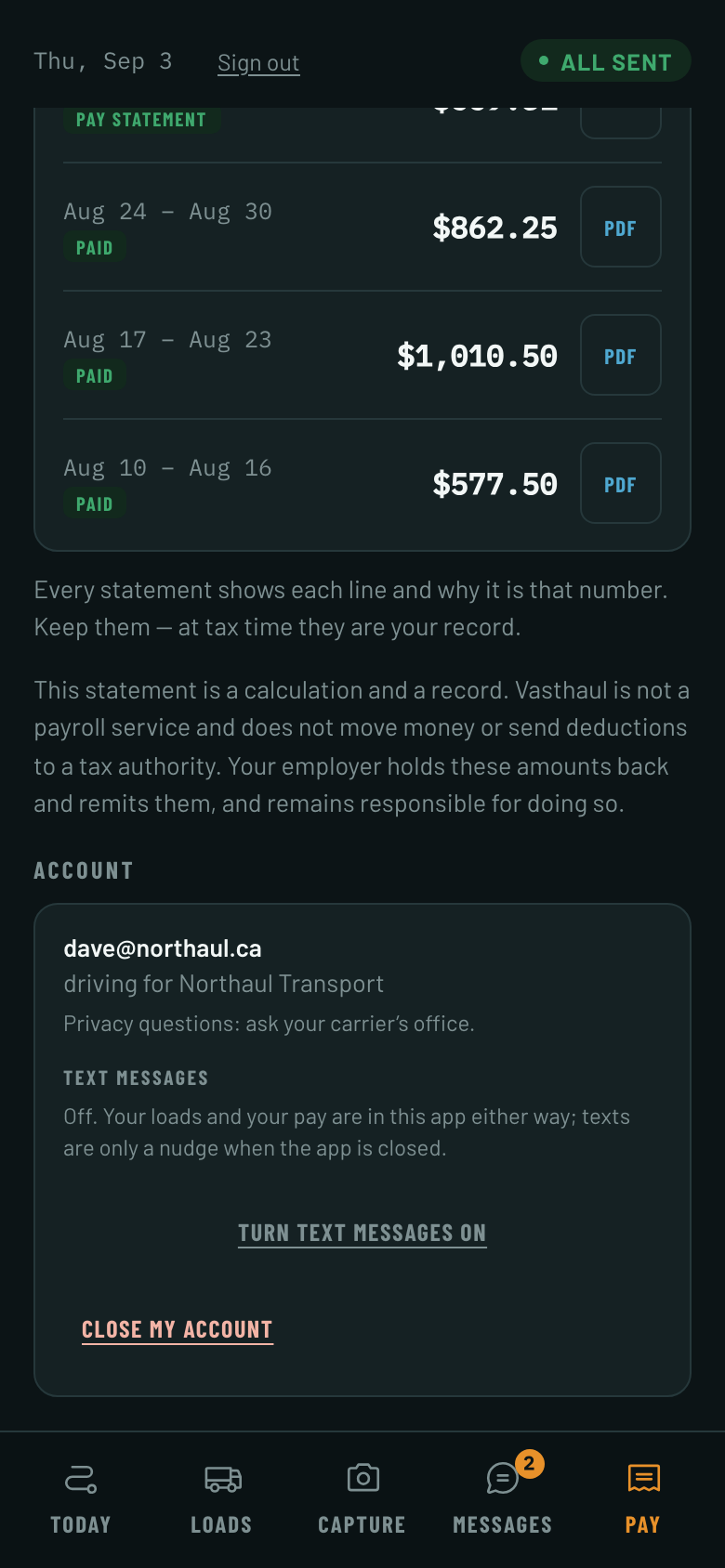 The driver app on a phone. The Pay tab is selected. At the foot of the screen an Account card shows the signed-in driver, and under the heading Text messages it reads: Off. Your loads and your pay are in this app either way; texts are only a nudge when the app is closed. Below that is one link, Turn text messages on.